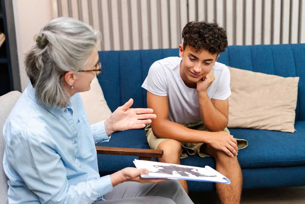 Therapist talks to teen about getting tested for ADHD