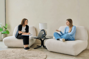 Teen talking with therapist during a relaxed first session.