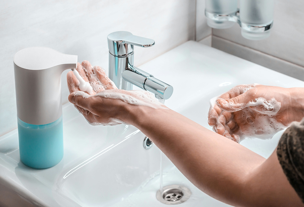 Teen repeatedly washing hands as a sign of OCD compulsions.