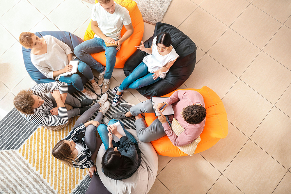 Teen participating in dual diagnosis group therapy for OCD and addiction recovery.